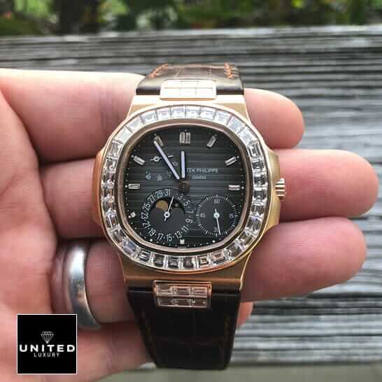Patek Philippe Baguette Replica 4 Patek Philippe Black Dial Brown Leather Bracelet Replica on the man hand