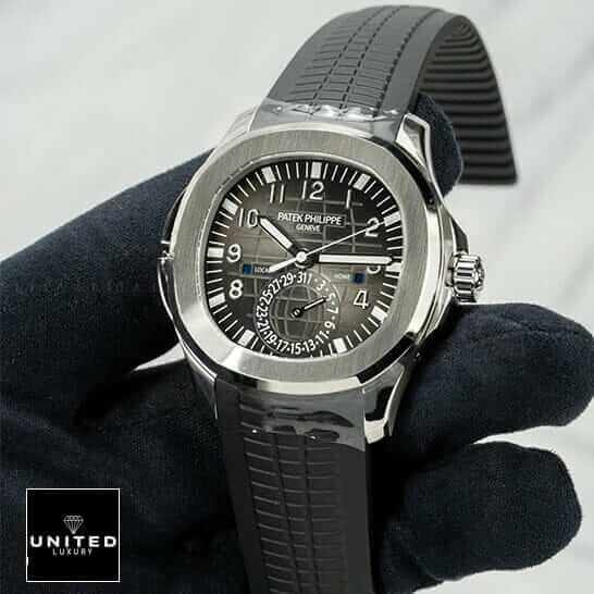 Patek Philippe Dual Time Replica 2 Patek Philippe Black Dial Steel Bezel Replica on the black glove hand