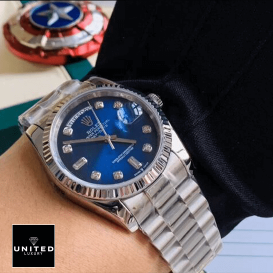 Rolex Day-Date 128239 Blue Dial With Diamond Replica 1 Rolex Day-Date 36 7118-1200R-01 Replica on his arm