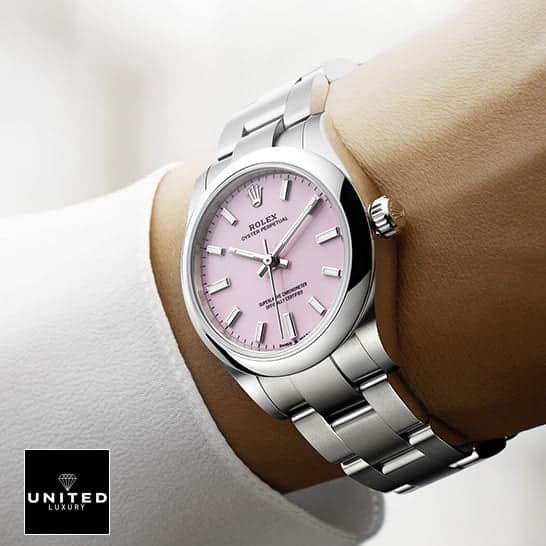 Rolex Perpetual Pink 124300 Replica 5 Rolex Oyster Perpetual 124300 Pink Dial Oyster Replica on his arm
