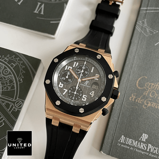AP Royal Oak Rose Replica 8 Audemars Piguet Black Dial 25940OK.OO_.D002CA.01 Gold Case Replica next to warranty card